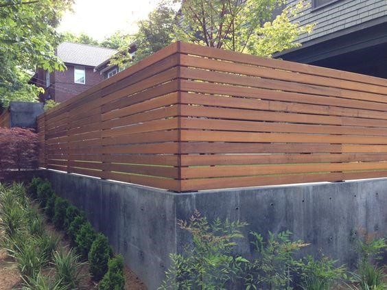 Wooden wall with concrete base