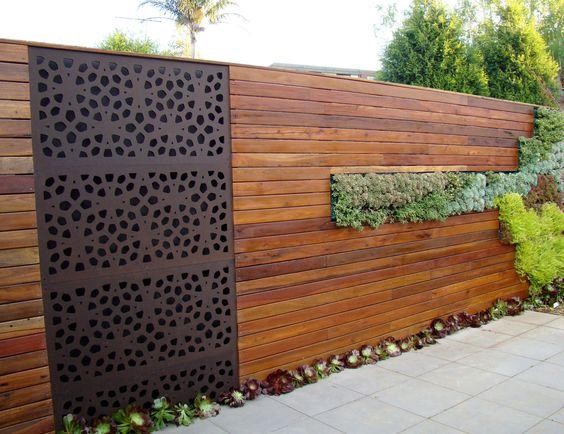 Wooden wall with plants and iron details